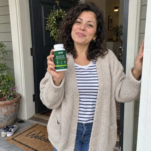 Customer on her porch, holding the bottle